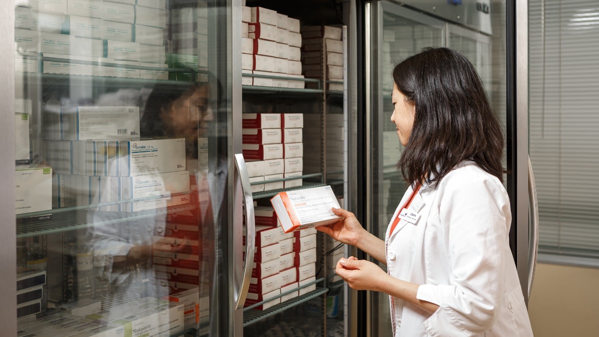 Pharmacist in white lab coat.
