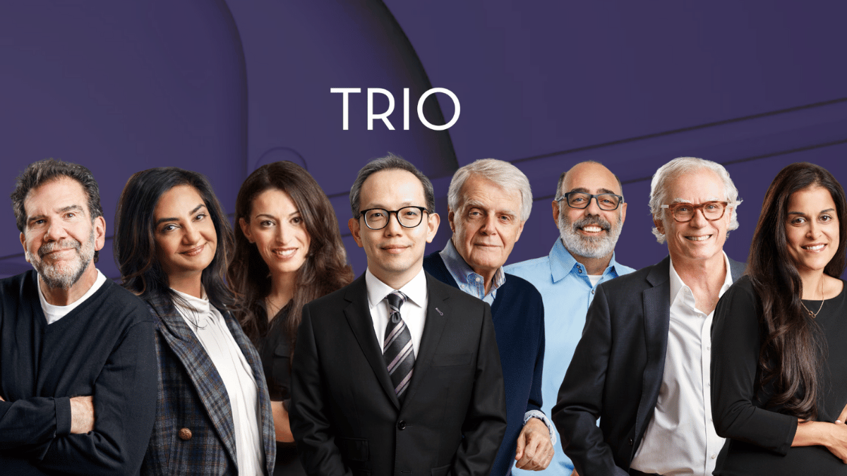 Group of TRIO MDs standing together, purple background