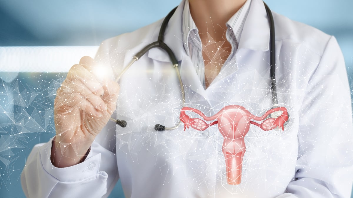 Illustration of a uterus with a photo of a person wearing lab coat and stethoscope