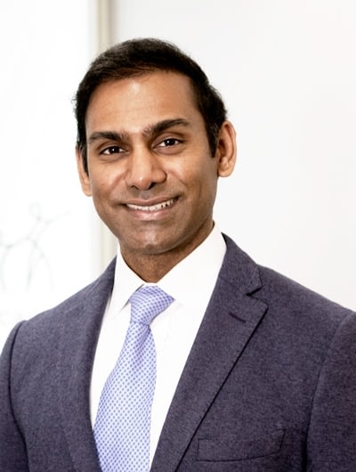 A photograph of Dr. Arnold Mahesan.