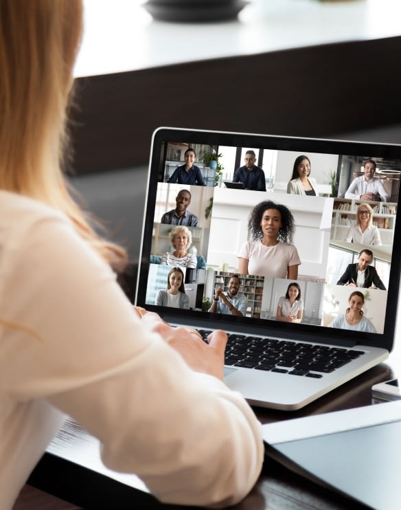 A woman looking at online fertility support group e on her laptop