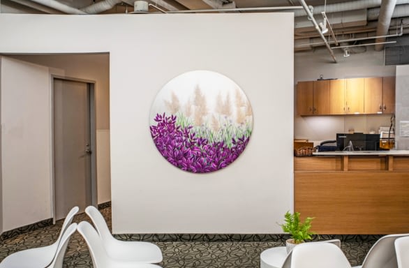 TRIO waiting room with purple and white mural painting on walls