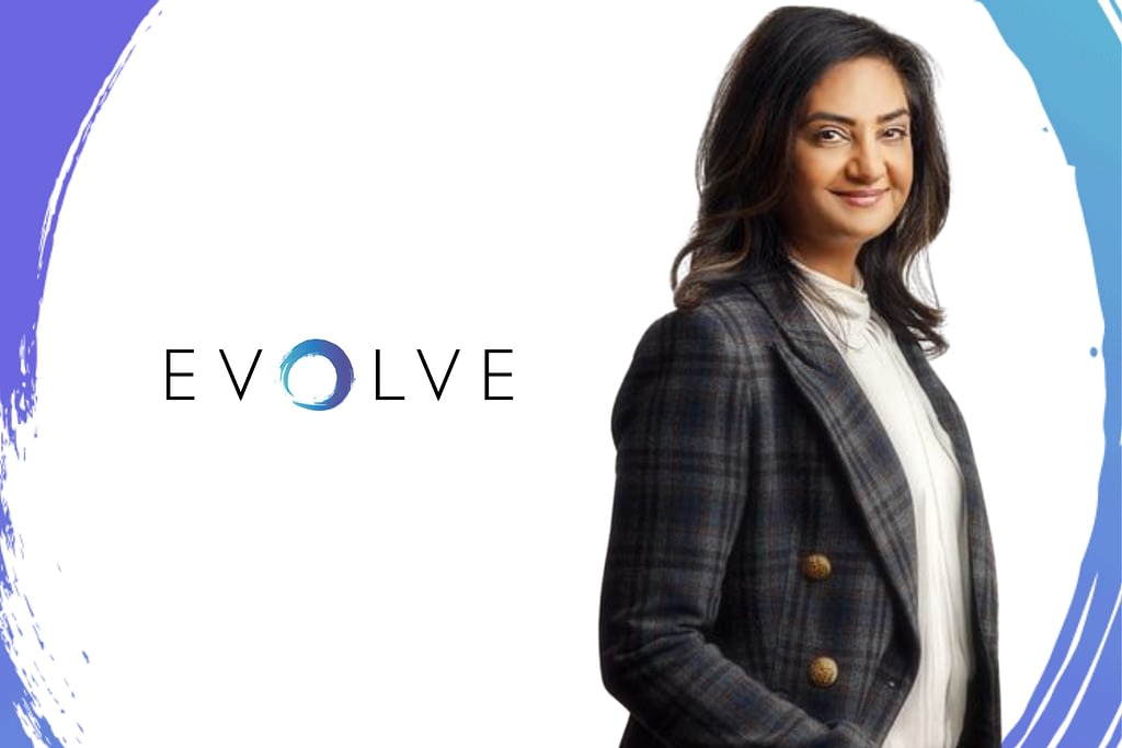 Photo of Dr. Sony Sierra with hands in pocket smiling with white background and EVOLVE logo and swirl
