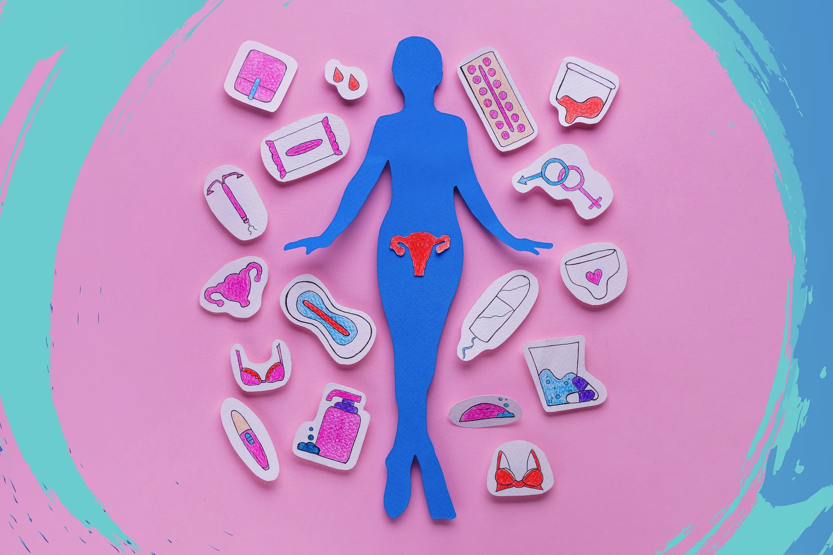 Paper cutout of person with a uterus that is surrounded by paper cutouts of feminine products.