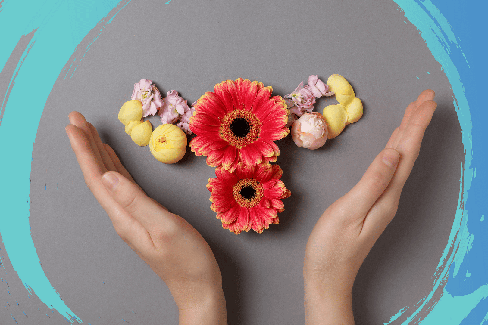 Hands framing a uterus shape made of flowers on a gray background.