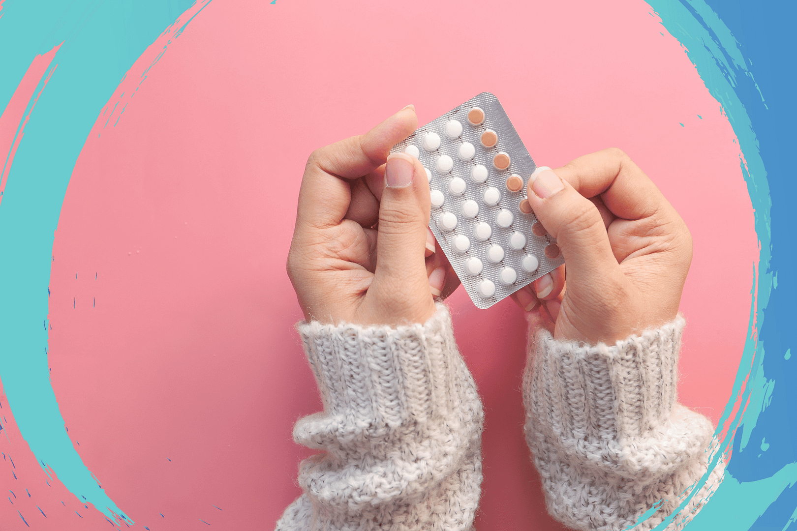 Women Hand Holding Birth Control Pills on Pink Background