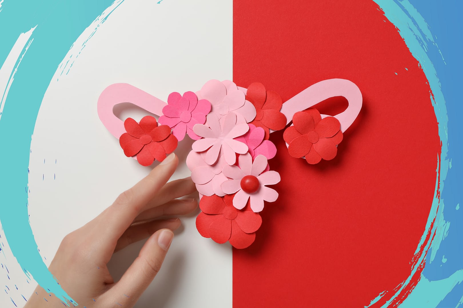 Uterus with flowers overtop made of paper.