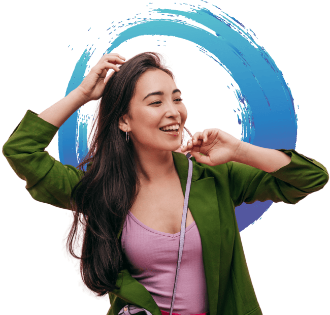 A smiling person standing in front of the Evolve logo.