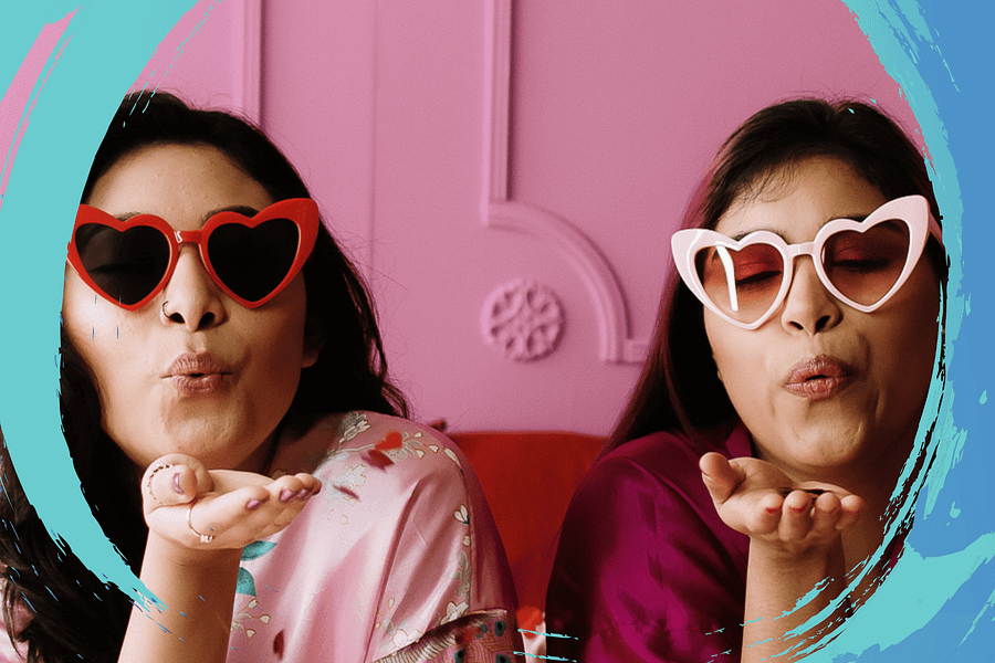 two friends blowing a kiss